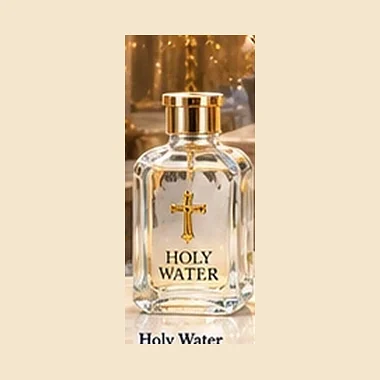 Glass bottle of holy water with a cross